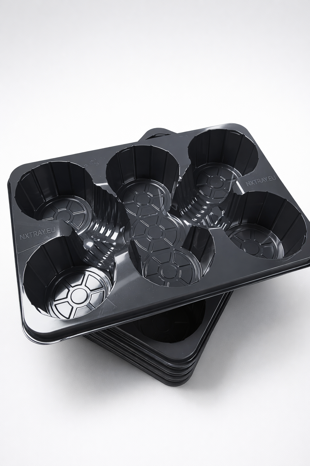 Stacked NXTray transport trays showing efficient nesting design
